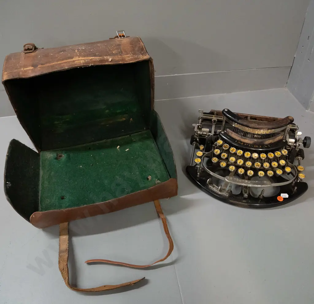 early 20th century Imperial portable typewriter in domed leather carry case - some corrosion and wear to case, has one Image 1++