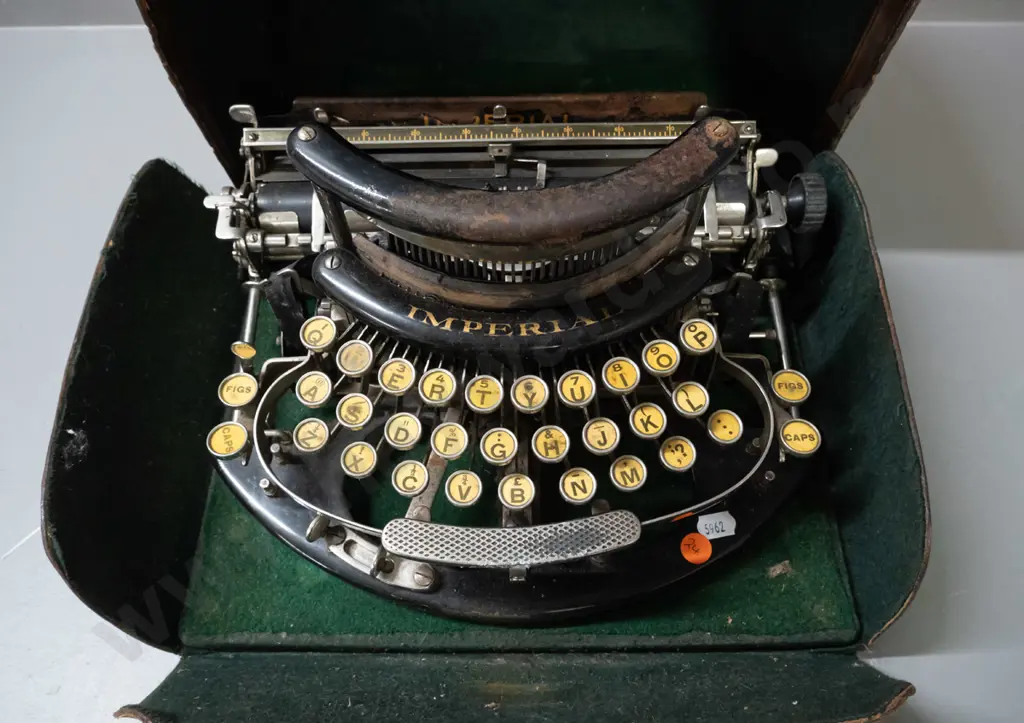 early 20th century Imperial portable typewriter in domed leather carry case - some corrosion and wear to case, has one Image 1++