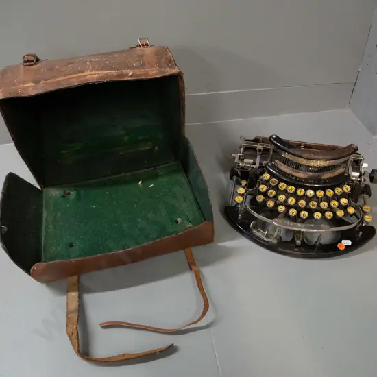 early 20th century Imperial portable typewriter in domed leather carry case - some corrosion and wear to case, has one
