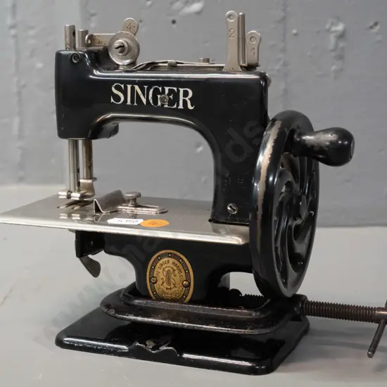 vintage Singer child's sewing machine with table top clamp - some paint wear and corrosion to chrome H-165 W-180