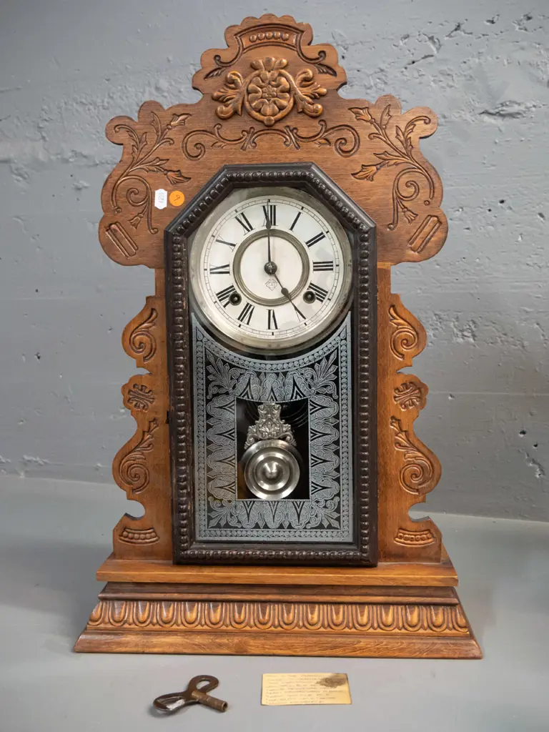 vintage Ansonia mantel clock with press-carved timber case, with key and chrome pendulum H-560 W-320 Image 1++