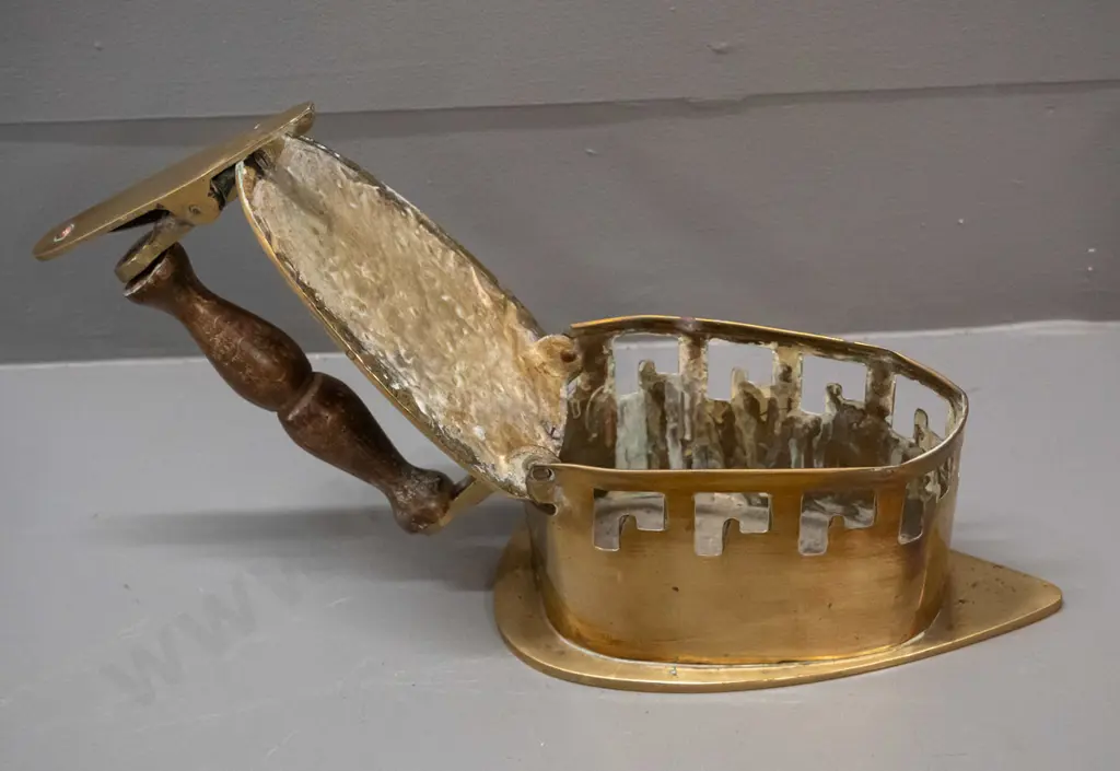 vintage brass coal iron with hinged tilting top, turned timber handle, spring clip mechanism - some discolouration to Image 1++