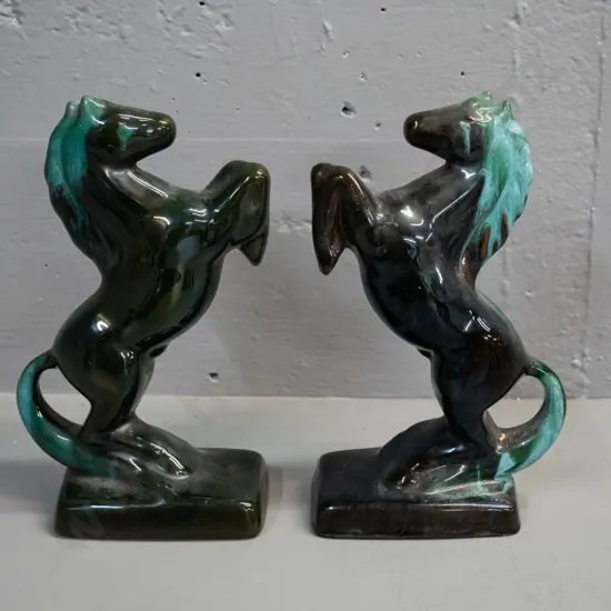pair of Blue Mountain teal pottery rearing horses H-230 W-130