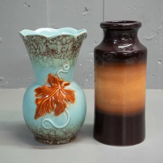 2 pottery vases - Teal Balclutha brown and orange speckle H-205 D-85 and an (English?) relief flower design, with crack