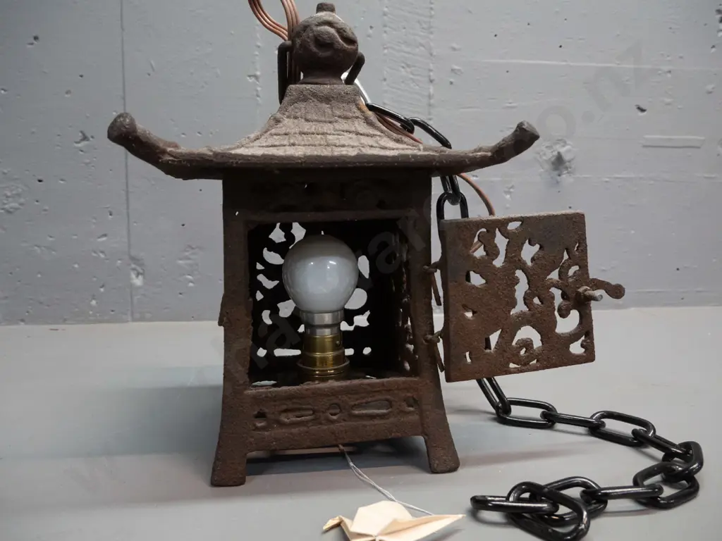 cast iron pagoda shape lamp or candle holder with hanging chain, converted to electric with light bulb fitting, cord has Image 1++