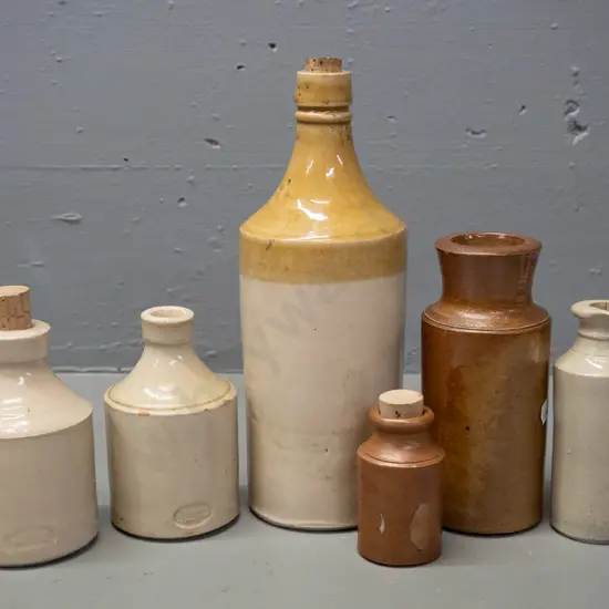 6 stoneware ink bottles, one smaller cream colour is marked Epsom Bendigo, other is Smith & Co London, a few small chips