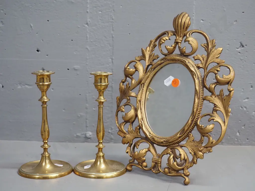 pair of cast brass candlesticks and a cast metal gilt-finish dressing table mirror H-280 W-210 Image 1++