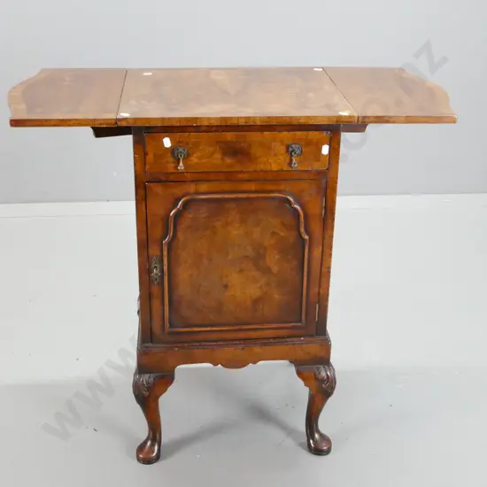 19th century walnut side / bedside cabinet with shaped drop side top, panelled cupboard door, metal drop handles,