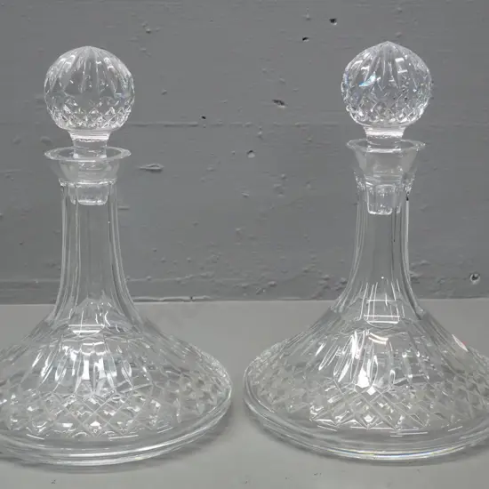 pair of cut crystal stoppered wide-base ship's decanters, one with Waterford mark H-260 D-180 - one stopper has small