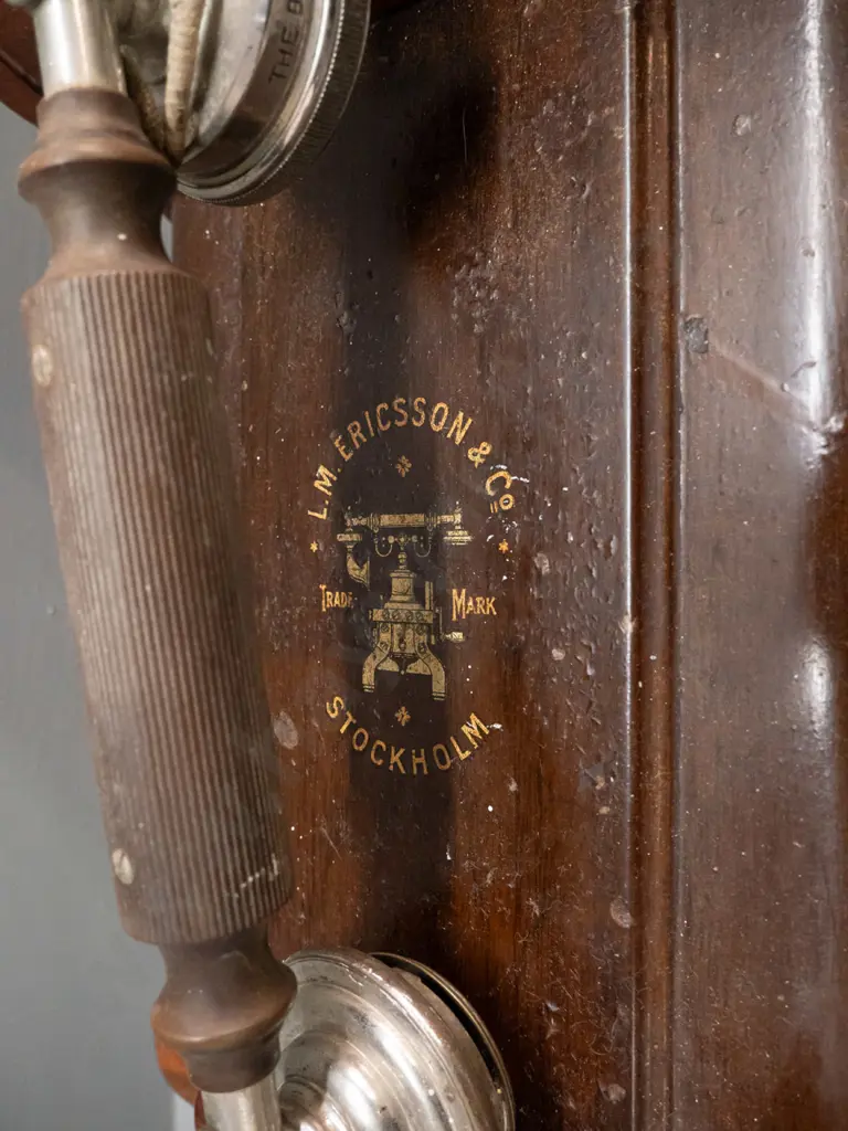 vintage Ericsson & Co Stockholm wall mounted hand crank telephone with walnut & metal case. Some corrosion to chrome Image 1++