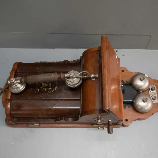 vintage Ericsson & Co Stockholm wall mounted hand crank telephone with walnut & metal case. Some corrosion to chrome
