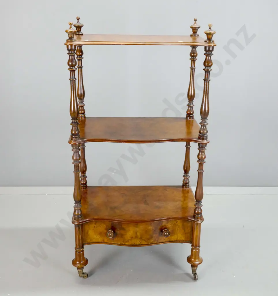 Victorian walnut 3-tier whatnot with turned uprights and finials, shaped bottom drawer with wooden knob, on brass cup Image 1++