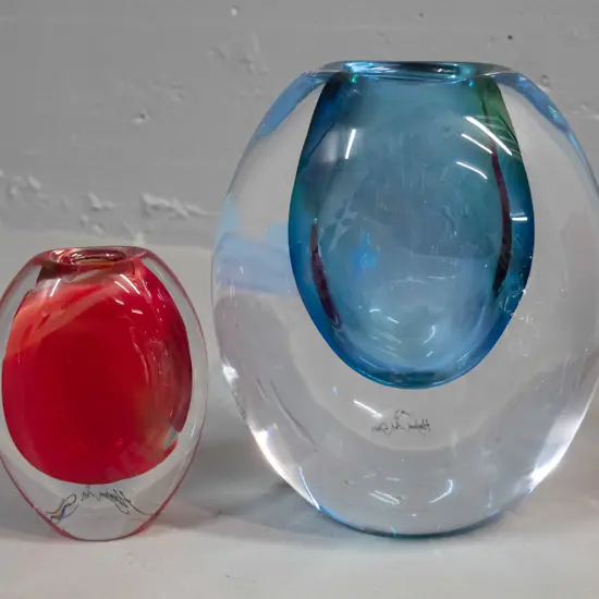 2 Hoglund heavy clear based art glass vases - larger blue is H-190 and red