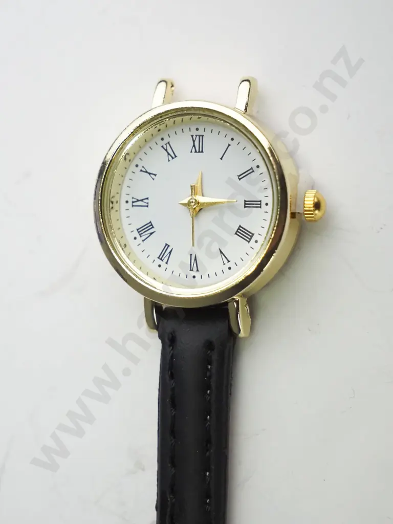 Small gold watch with thin brown strap (broken) Image 1++