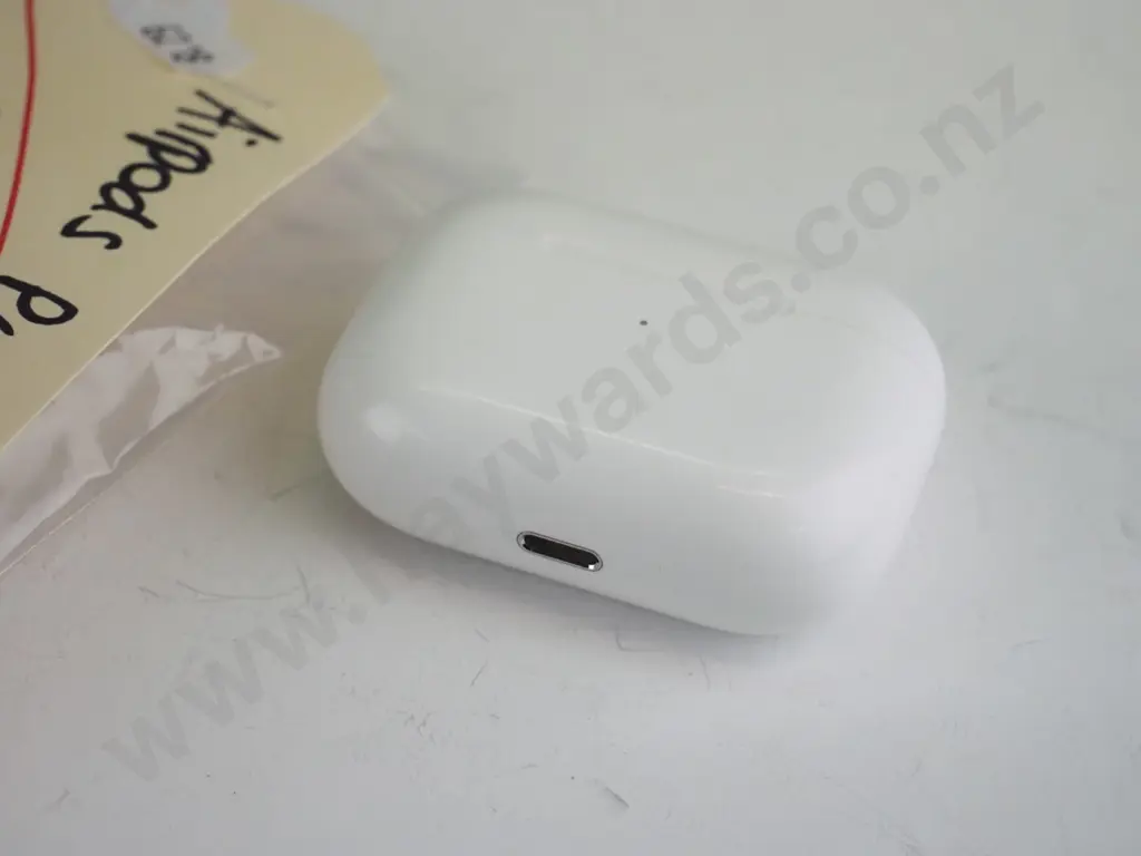 White Apple airpod case with 2 ear buds Image 1++