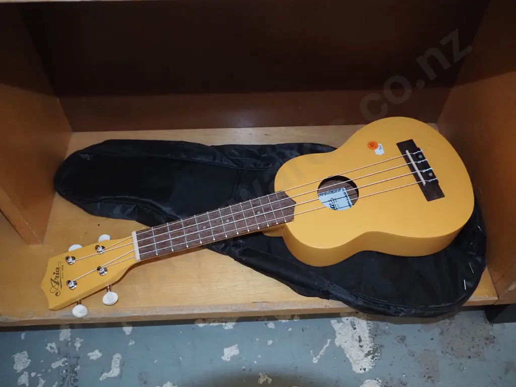Yellow Ukulele in black bag Image 1++