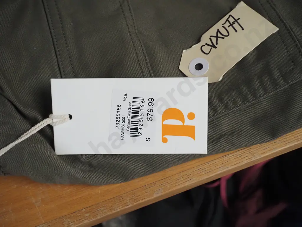 Panna shorts coloured green with a tag attached Image 1++