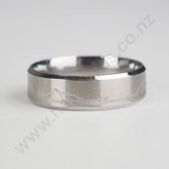 silver ring with mountain range engraved
