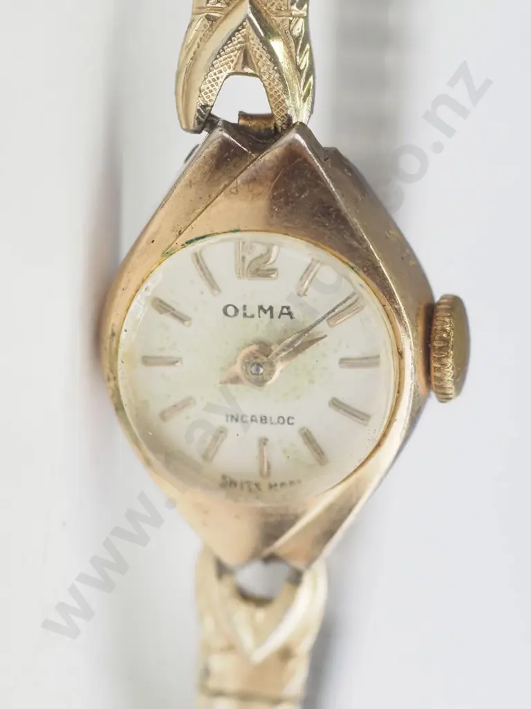 Small older style gold watch - elasticated band. Image 1++