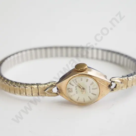 Small older style gold watch - elasticated band.