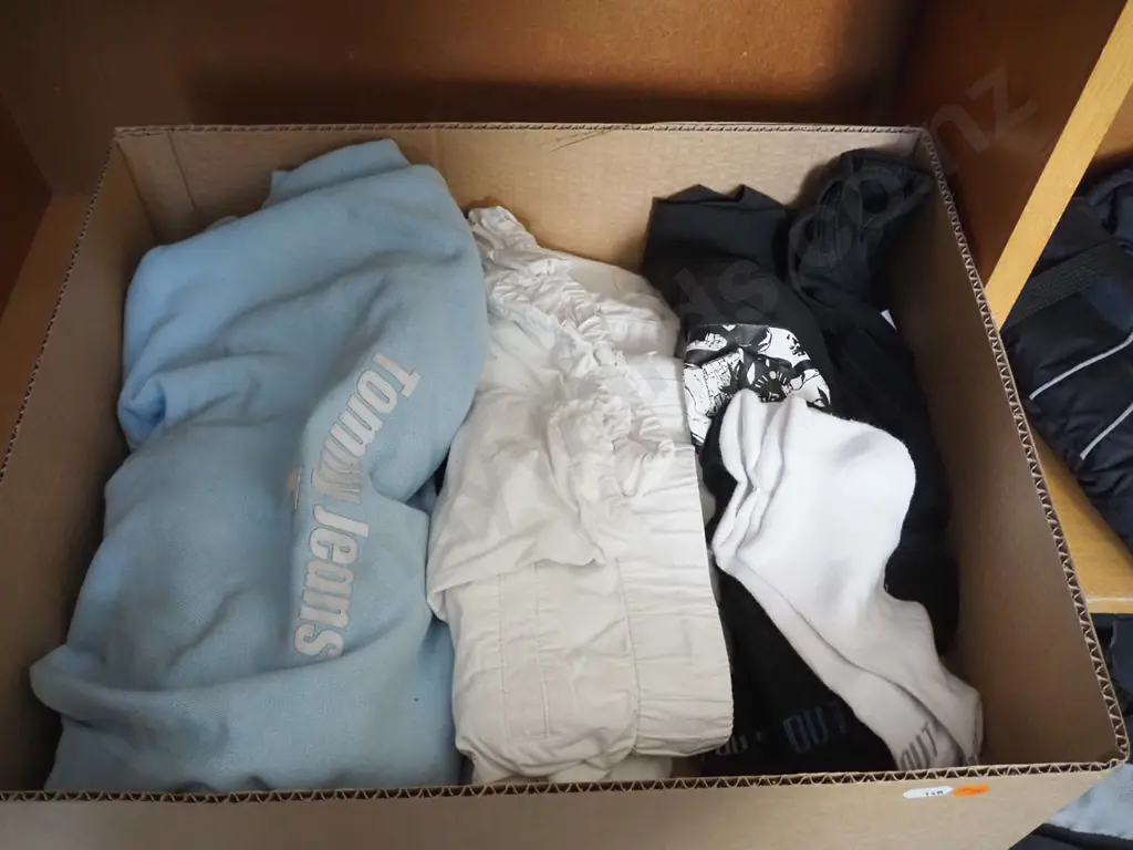 Blue hoodie, bunch of black socks, white pants and black huffer shirt. Image 1++