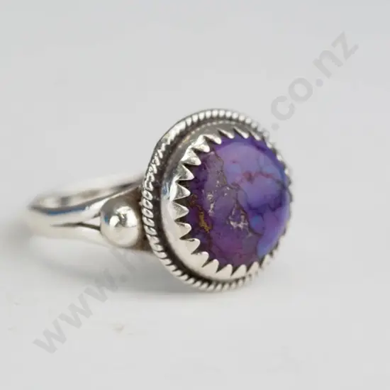 Silver ring with purple stone -round setting