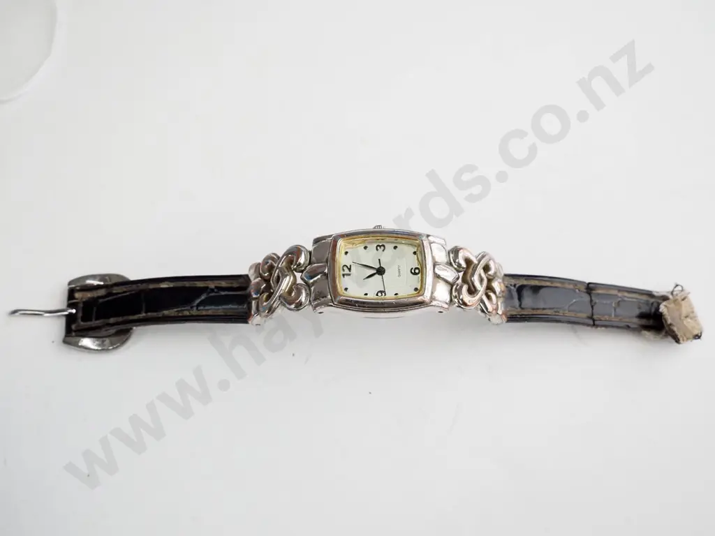 Square faced ladies watch - celtic silver detail in brown strap - worn Image 1++