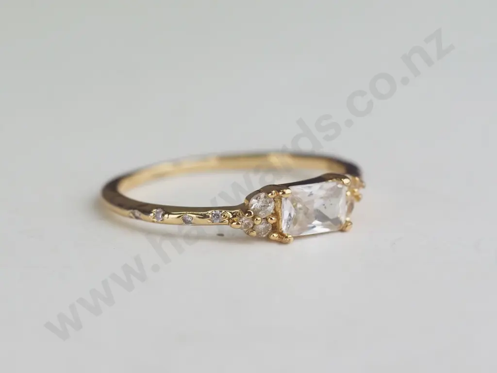 Gold Coloured ring with white/silver gems Image 1++