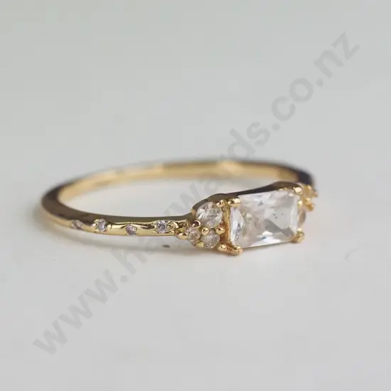Gold Coloured ring with white/silver gems