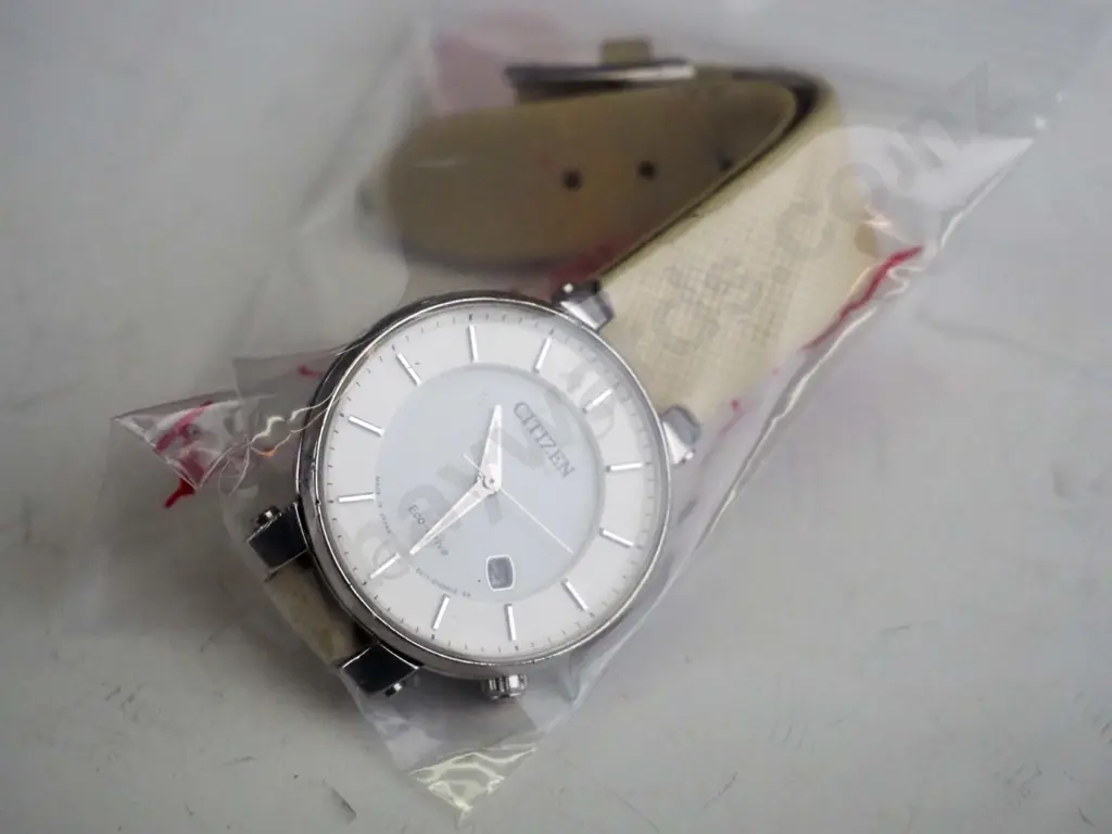 white Citizen watch with cream strap Image 1++
