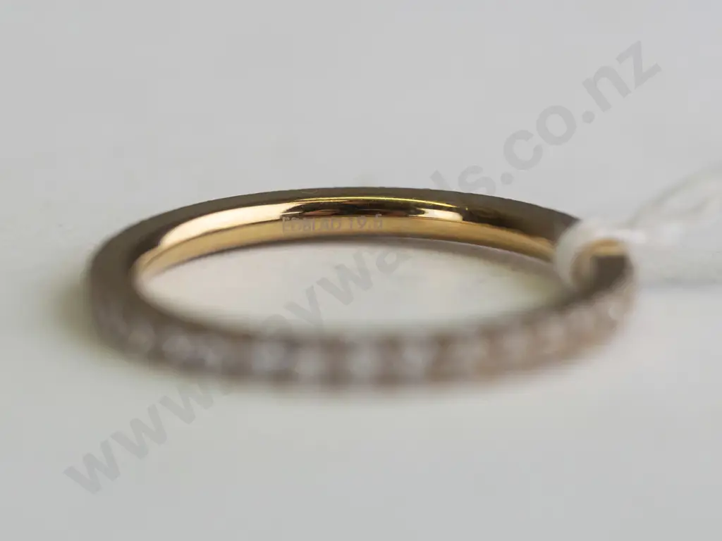 Gold banded ring with rhinestones around the entire band. Image 1++