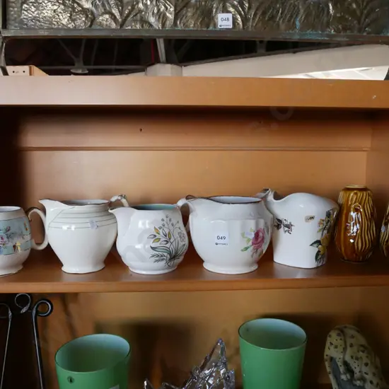 2x Irish porcelain vases, 5x milk jugs