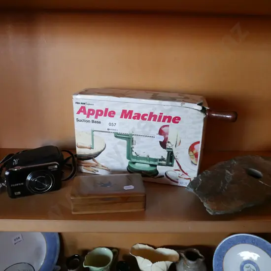 digital camera, trinket box, apple peeler, schist vase