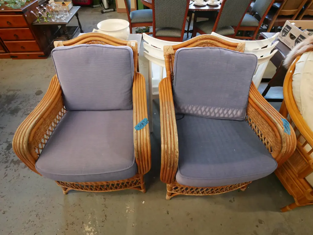 2x bamboo, cane armchairs with blue upholstered cusions - fading Image 1++
