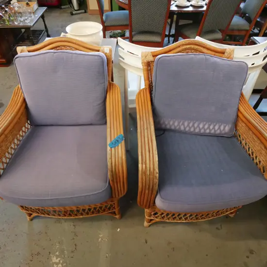 2x bamboo, cane armchairs with blue upholstered cusions - fading