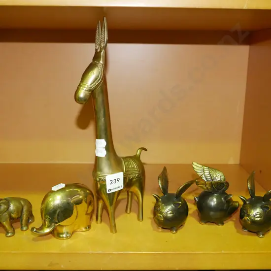 shelf of brass figurines Tallest H-280