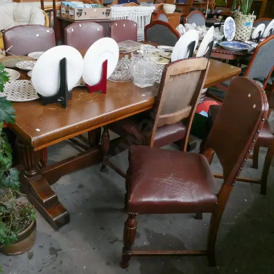 solid oak refectory dining table with 6 brown vinyl chairs - rips to chairs, marks to table