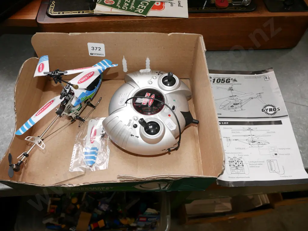 small blue and green remote control helicopter Image 1++