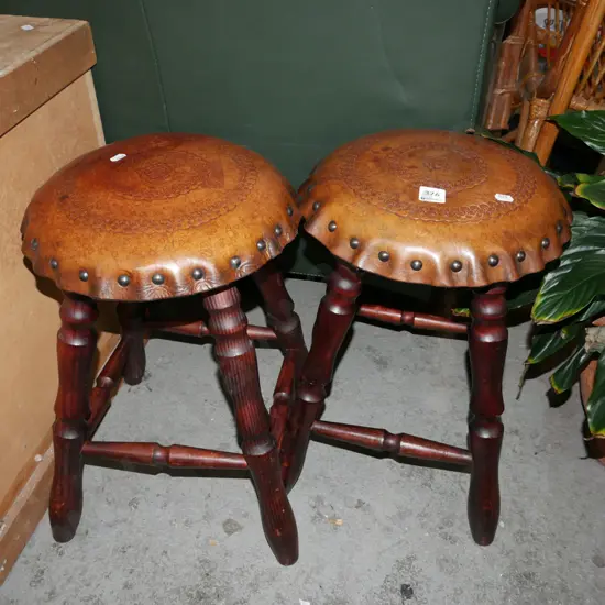 pair of tooled leather top pine stools