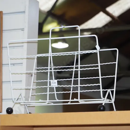 retro metal magazine rack with black ball feet