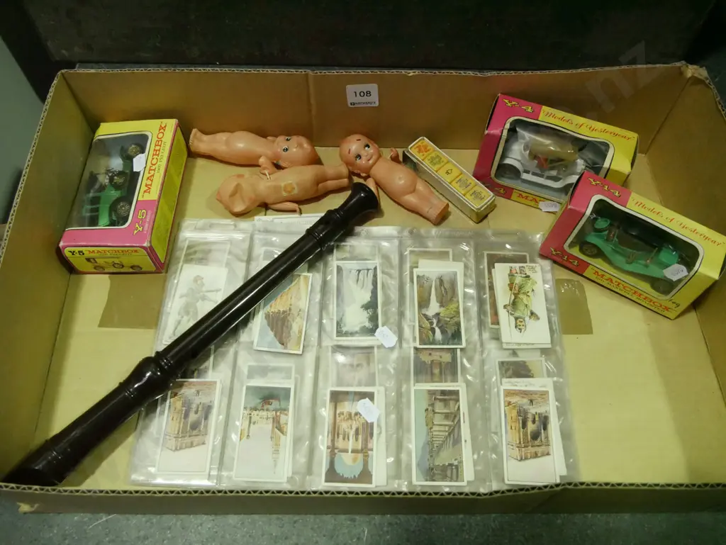 box of model vehicles, cigarette cards, recorder, etc. Image 1++