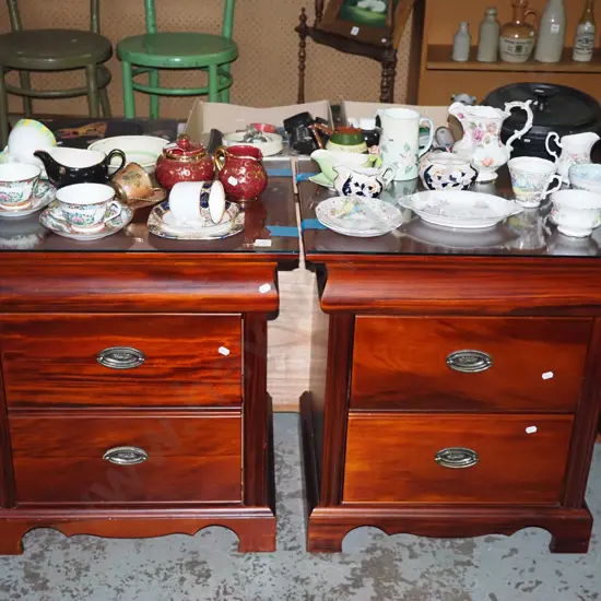 pair of stained pine 2 drawer bedside cabinets with glass tops