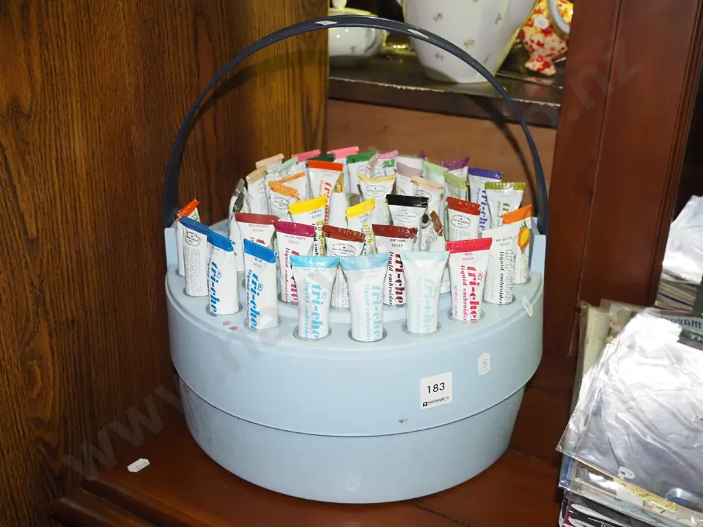 assorted fabric paints in portable plastic holder Image 1++