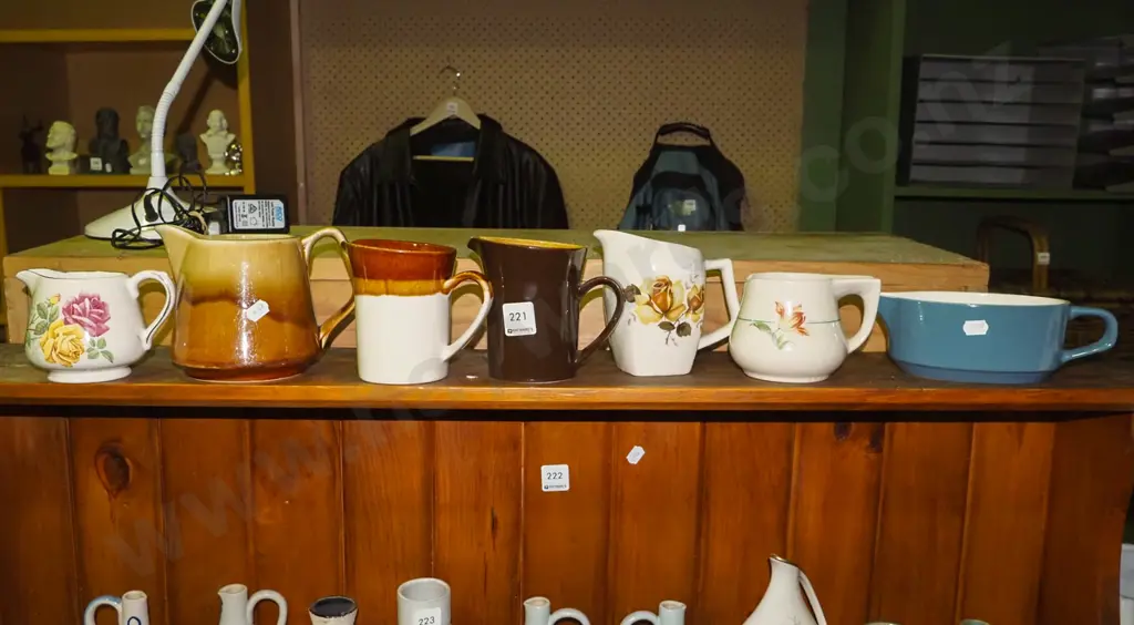 shelf of Crown Lynn jugs Image 1++