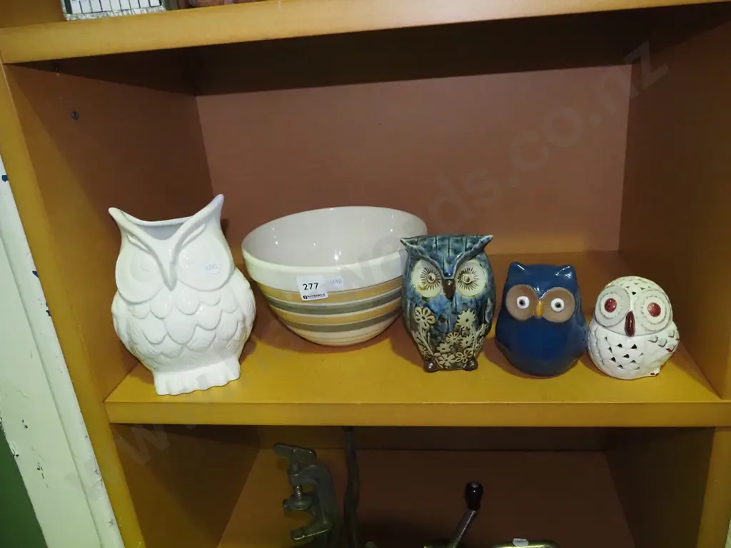 shelf of ornamental owls and a mixing bowl Image 1++