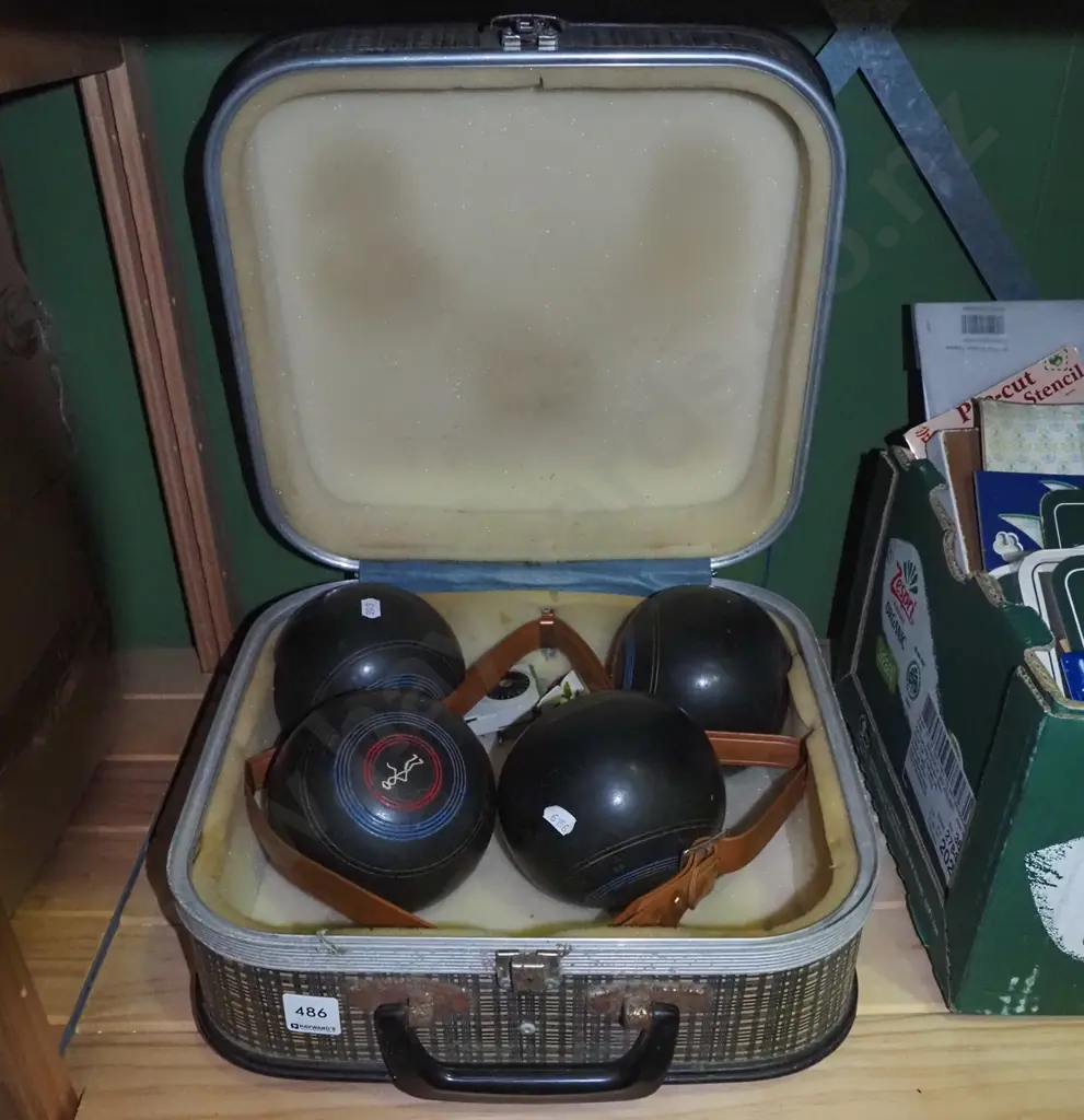 vintage lawn bowls in suitcase Image 1++