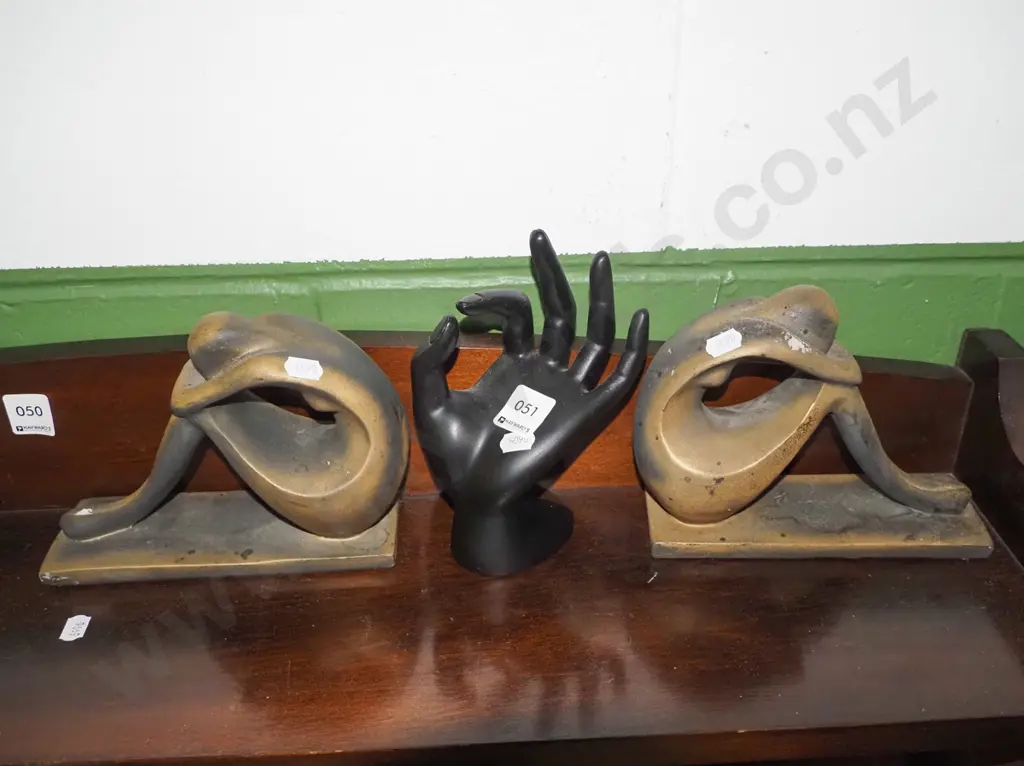 2x figural book ends, hand ring stand Image 1++
