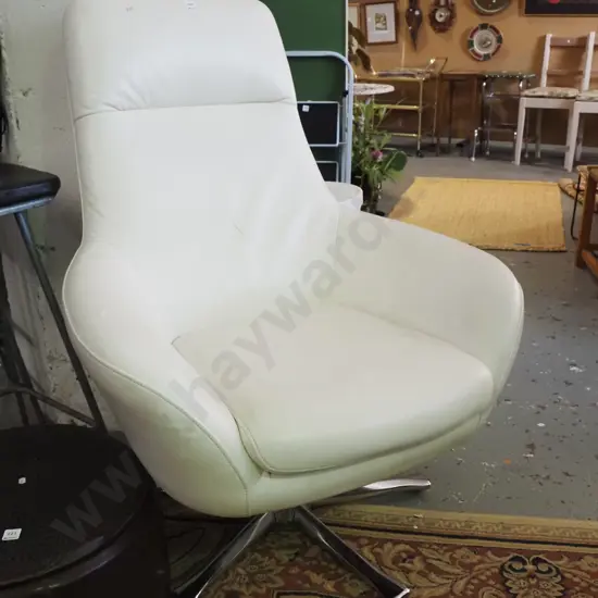 cream vinyl upholstered swivel chair