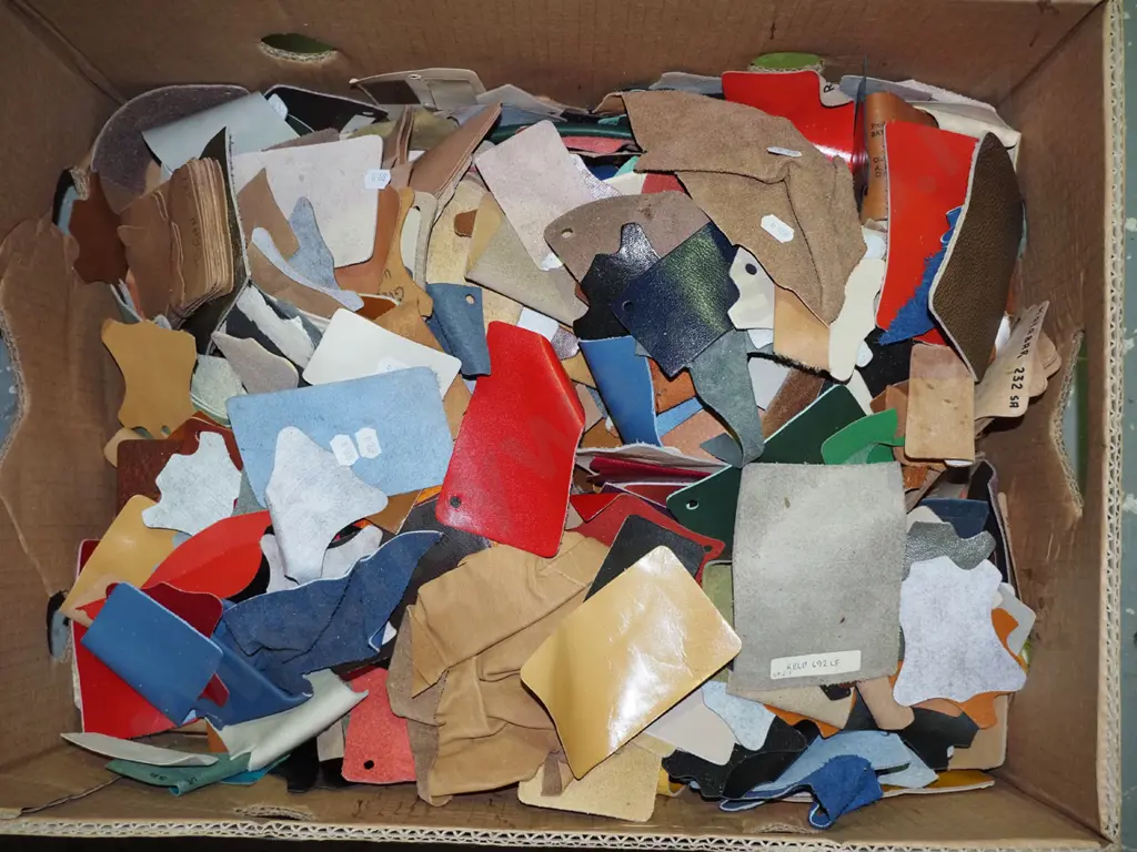 box of scrap leather pieces Image 1++
