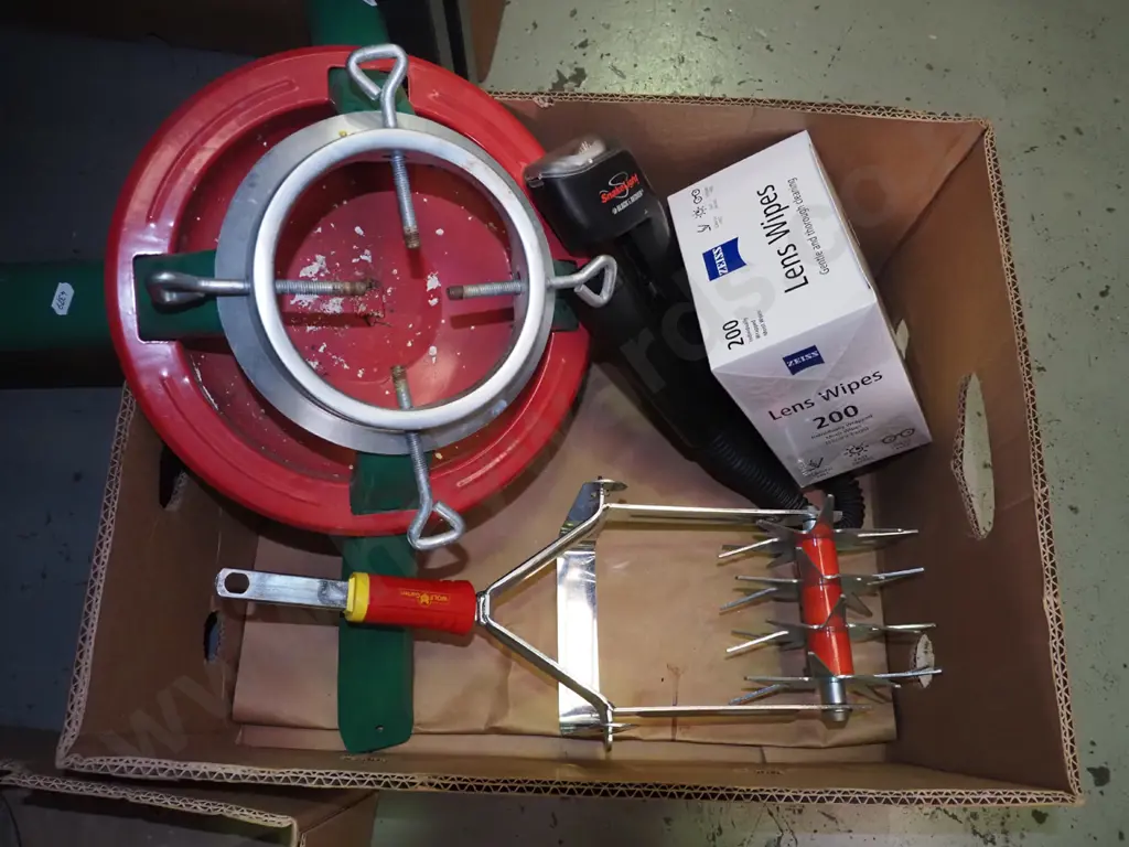 box: Christmas tree stand, lens wipes, part garden cultivator, etc. Image 1++